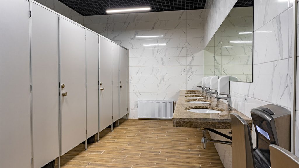 Eshine Cleaning Services providing restroom cleaning in a commercial washroom